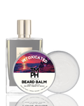 Beard balm packaging with a sunset design and branding on a white background