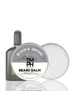 TM PH Black & Orchid beard balm with a bottle on a white background