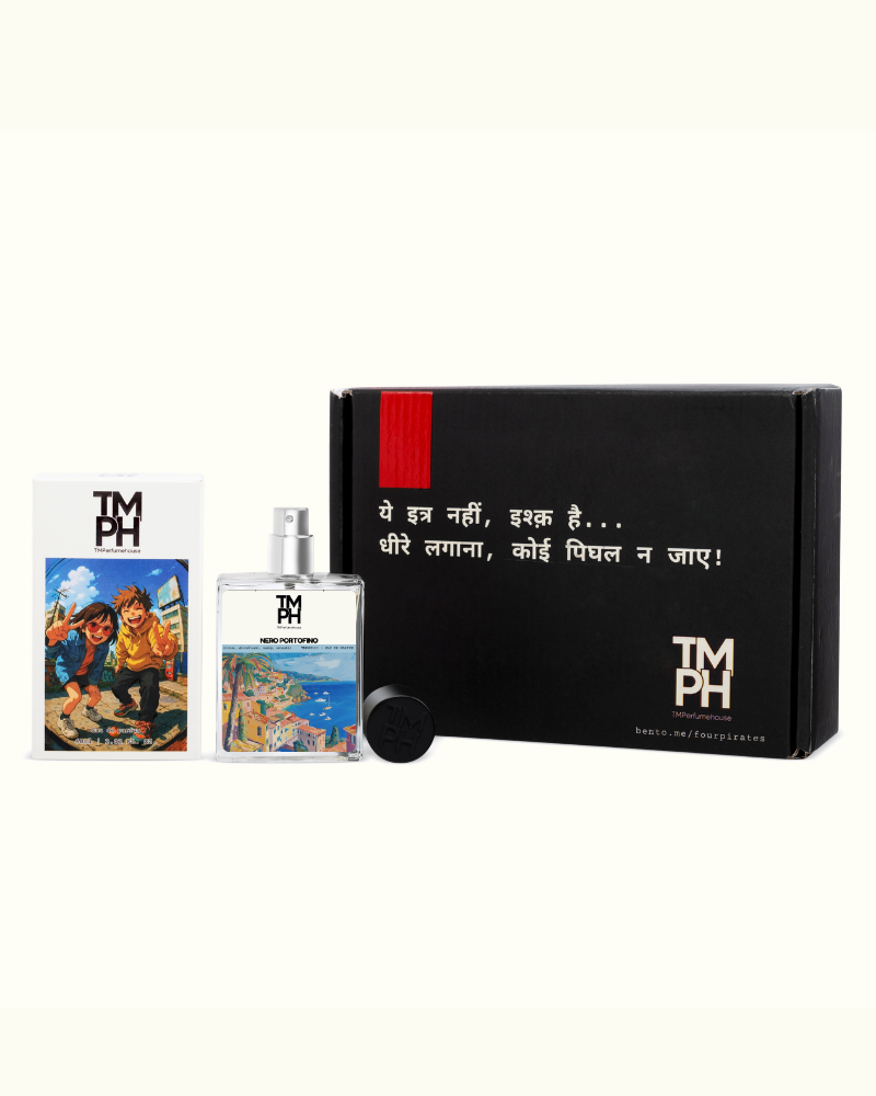 Perfume bottle with packaging and cards featuring 'TMH' branding on a white background